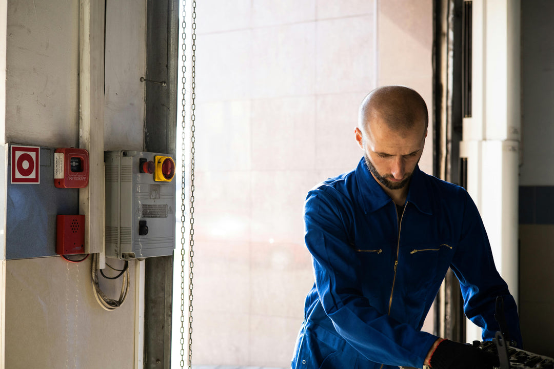Electrician Wearing Blue Protective Body Suit