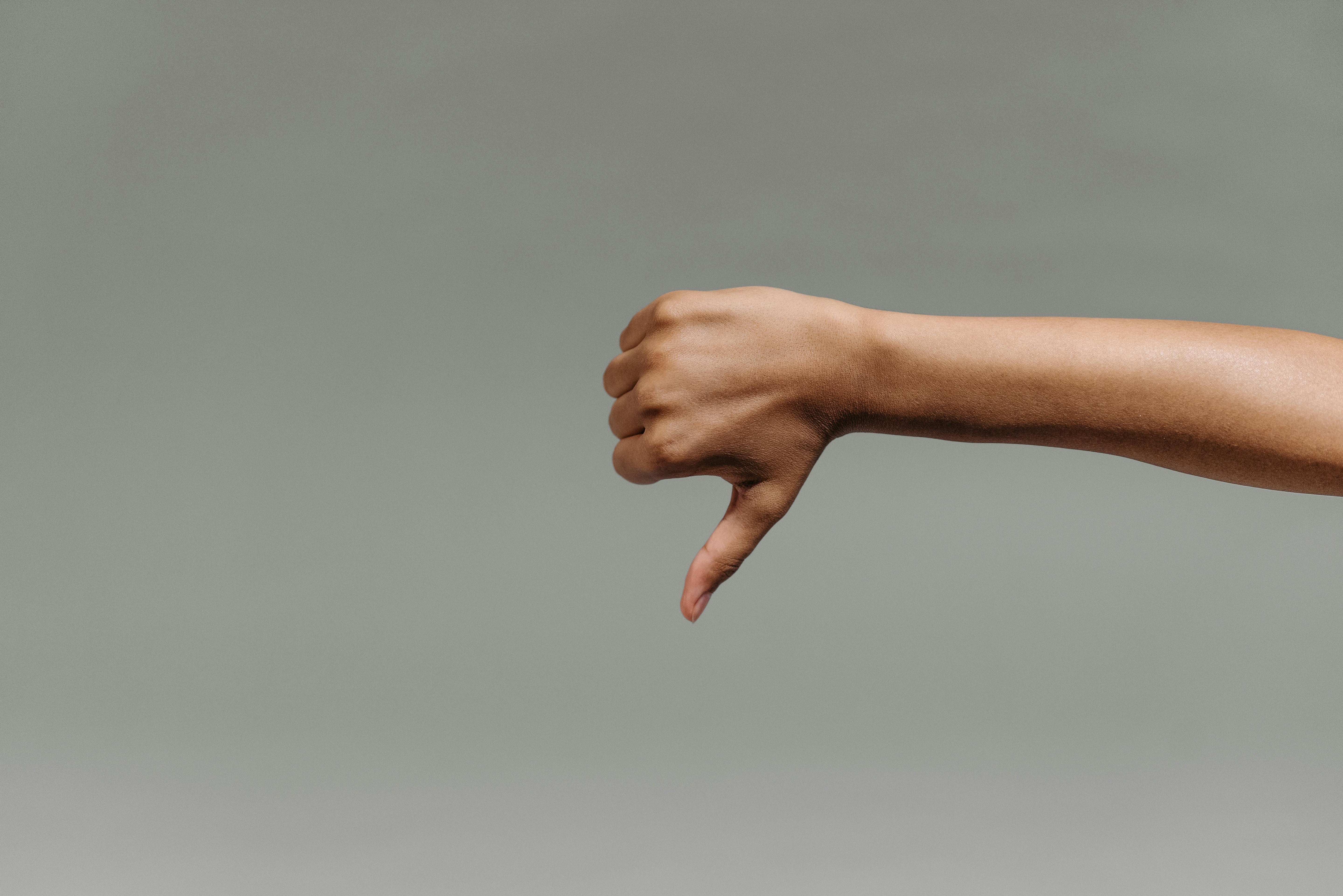Persons Doing a Thumbs Down